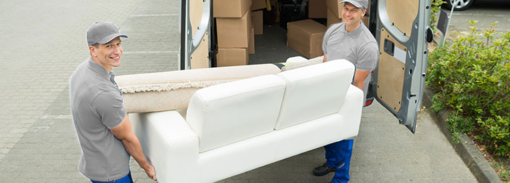 Two-Classic-Moves-Movers-Lifting-Heavy-Couch-Out-Of-Van